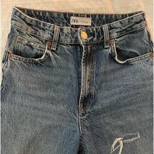 Zara high-rise jeans with distressed knees.